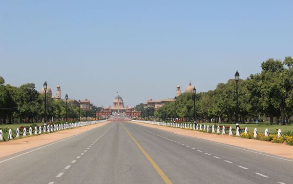 Rastrapathi Bhavan or Presidential Palace – the road in front of Rastrapathi Bhavan is the venue for India’s annual Republic Day Parade. The central vista connecting Rastrapathi Bhavan and India Gate is always crowded, but completely deserted now during the lockdown.  - Sputnik International