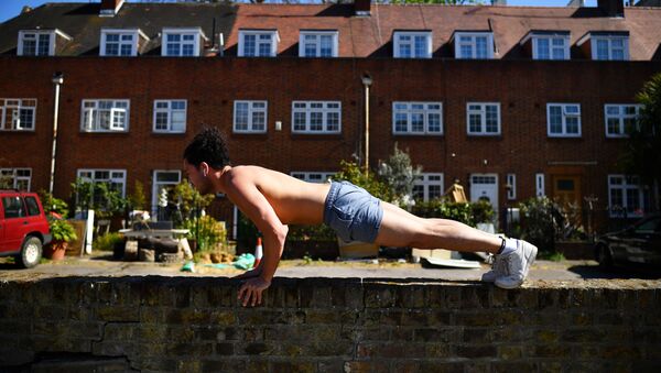 Man exercises outside his home in London, as the spread of the coronavirus disease (COVID-19) continues - Sputnik International
