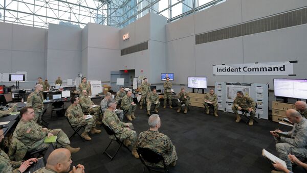 Members of the New York Army and Air National Guard brief the Incident Commander at the Unified Command Javits Incident Command Post in the Javits New York Medical Station at the Jacob K. Javits Convention Center during the coronavirus disease (COVID-19) outbreak in Manhattan, New York City, US, April 3, 2020 - Sputnik International