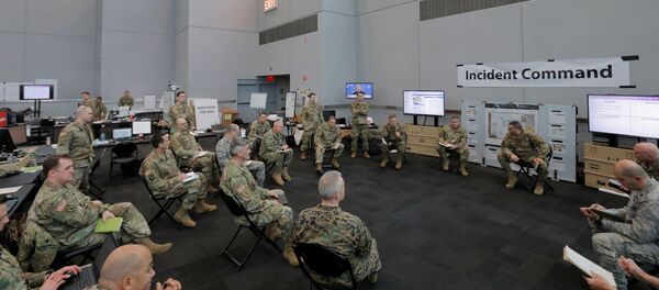Members of the New York Army and Air National Guard brief the Incident Commander at the Unified Command Javits Incident Command Post in the Javits New York Medical Station at the Jacob K. Javits Convention Center during the coronavirus disease (COVID-19) outbreak in Manhattan, New York City, US, April 3, 2020 Members of the New York Army and Air National Guard brief the Incident Commander at the Unified Command Javits Incident Command Post in the Javits New York Medical Station at the Jacob K. Javits Convention Center during the coronavirus disease (COVID-19) outbreak in Manhattan, New York City, US, April 3, 2020 - Sputnik International