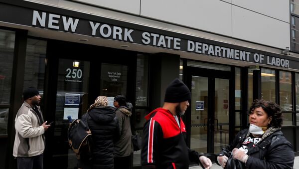 People gather at the entrance for the New York State Department of Labor offices, which closed to the public due to the coronavirus disease (COVID-19) outbreak in the Brooklyn borough of New York City, 20 March 2020 - Sputnik International