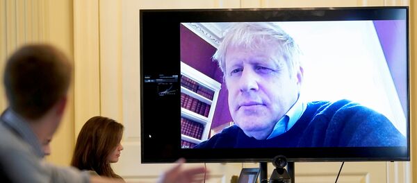 Britain's Prime Minister Boris Johnson appears on a monitor for the coronavirus disease (COVID-19) meeting in London, Britain March 28, 2020 Britain's Prime Minister Boris Johnson appears on a monitor for the coronavirus disease (COVID-19) meeting in London, Britain March 28, 2020 - Sputnik International