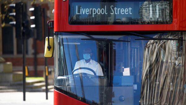  A bus driver wearing a face mask is seen in London - Sputnik International