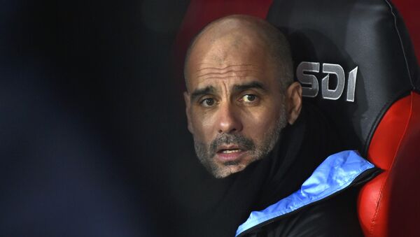 Manchester City's head coach Pep Guardiola looks out from the bench prior the English Premier League soccer match between Sheffield United and Manchester City at Bramall Lane in Sheffield, England, Tuesday, Jan. 21, 2020. - Sputnik International
