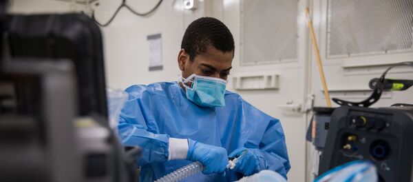 U.S. Army Specialist Fredrick Spencer assembles a T1 Hamilton ventilator in a mobile lab unit in the Javits New York Medical Station intensive care unit bay monitoring coronavirus disease (COVID-19) patients in New York City, U.S. Apri 4, 2020 - Sputnik International