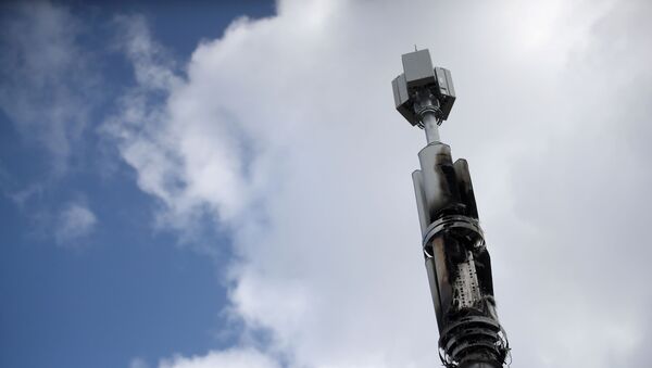 A telecommunications mast damaged by fire is seen in Sparkhill, masts have in recent days been vandalised amid conspiracy theories linking the coronavirus disease (COVID-19) and 5G masts, Birmingham, Britain, April 6, 2020. - Sputnik International