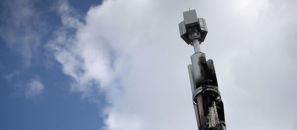 A telecommunications mast damaged by fire is seen in Sparkhill, masts have in recent days been vandalised amid conspiracy theories linking the coronavirus disease (COVID-19) and 5G masts, Birmingham, Britain, April 6, 2020. A telecommunications mast damaged by fire is seen in Sparkhill, masts have in recent days been vandalised amid conspiracy theories linking the coronavirus disease (COVID-19) and 5G masts, Birmingham, Britain, April 6, 2020. - Sputnik International