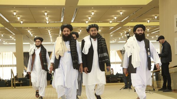 Afghanistan's Taliban delegation arrive for the agreement signing between Taliban and U.S. officials in Doha, Qatar, Saturday, Feb. 29, 2020. - Sputnik International