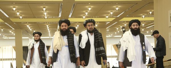Afghanistan's Taliban delegation arrive for the agreement signing between Taliban and U.S. officials in Doha, Qatar, Saturday, Feb. 29, 2020. - Sputnik International