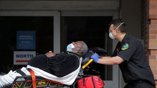 Paramedics take a patient into emergency center at Maimonides Medical Center during outbreak of coronavirus disease (COVID-19) in Brooklyn New York - Sputnik International