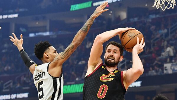 Mar 8, 2020; Cleveland, Ohio, USA; Cleveland Cavaliers forward Kevin Love (0) grabs a rebound from San Antonio Spurs guard Dejounte Murray (5) during the first half at Rocket Mortgage FieldHouse. - Sputnik International