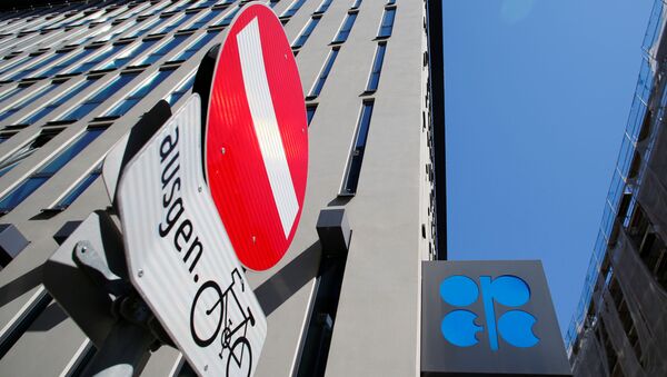 The logo of the Organization of the Petroleoum Exporting Countries (OPEC) and a traffic sign are seen outside of OPEC's headquarters in Vienna, Austria April 9, 2020 - Sputnik International