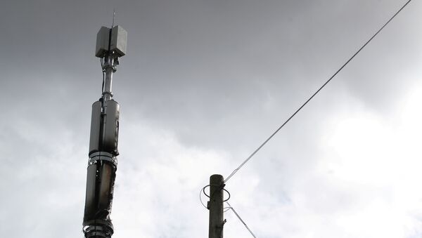 A telecommunications mast damaged by fire is seen in Sparkhill, masts have in recent days been vandalised amid conspiracy theories linking the coronavirus disease (COVID-19) and 5G masts, Birmingham, Britain, April 6, 2020 - Sputnik International