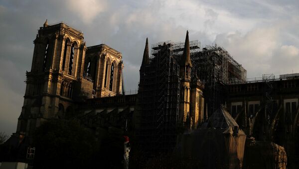 A view shows Notre Dame Cathedral, which was damaged in a devastating fire almost one year ago, in Paris ahead of Easter celebrations to be held under lockdown imposed to slow the spread of the coronavirus disease (COVID-19) in France, 7 April 2020. - Sputnik International