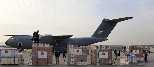 Soldiers prepare to load a military cargo plane with Personal Protection Equipment heading to Italy and Spain to help the countries combat the new coronavirus outbreak, in Ankara, Turkey, Wednesday, 1 April 2020. The new coronavirus causes mild or moderate symptoms for most people, but for some, especially older adults and people with existing health problems, it can cause more severe illness or death. - Sputnik International