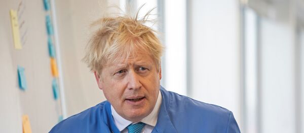 In this file photo taken on 6 March 2020 Britain's Prime Minister Boris Johnson visits to the Mologic Laboratory in the Bedford technology Park, north of London . - Britain's Prime Minister Boris Johnson appeared to be on the road to recovery as Downing Street said the Prime Minister had returned to the ward at St Thomas' Hospital after spending three nights in the intensive care unit. - Sputnik International