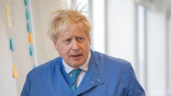 In this file photo taken on 6 March 2020 Britain's Prime Minister Boris Johnson visits to the Mologic Laboratory in the Bedford technology Park, north of London . - Britain's Prime Minister Boris Johnson appeared to be on the road to recovery as Downing Street said the Prime Minister had returned to the ward at St Thomas' Hospital after spending three nights in the intensive care unit. - Sputnik International
