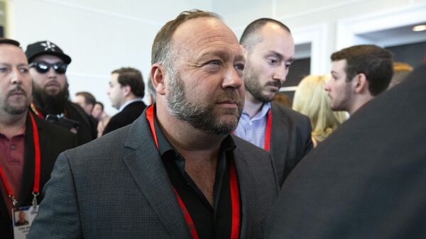 Conspiracy theorist Alex Jones walks at the Conservative Political Action Conference, CPAC 2020, at the National Harbor, in Oxon Hill, Md., Thursday, Feb. 27, 2020 - Sputnik International