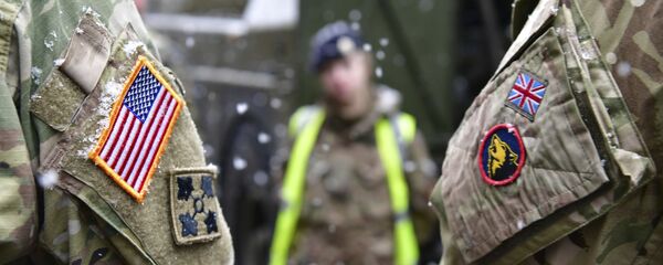 A British and an United States soldier stand side by side after a press conference on the military exercise 'Defender 2020' in Brueck, Germany, Wednesday, Feb. 26, 2020. The exercise with 37000 participants from a total of 18 nations will take place in Europe between January and about June 2020. - Sputnik International
