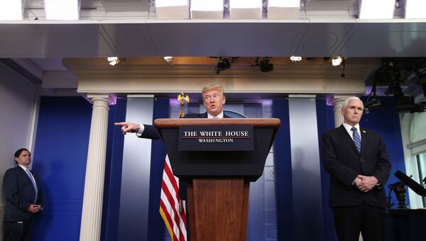 U.S. President Donald Trump answers a question during the coronavirus response daily briefing with Vice President Mike Pence at his side at the White House in Washington, U.S., April 10, 2020 - Sputnik International