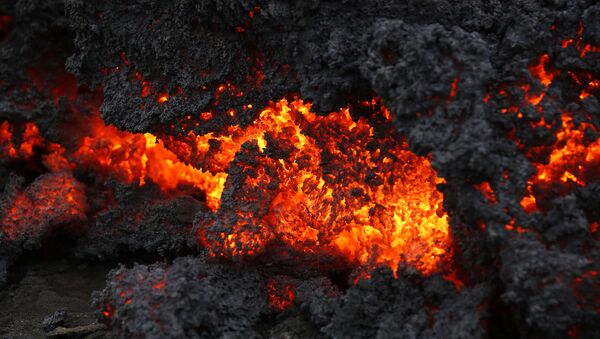 A close up of lava from an eruption on Holuhraun, northwest of the Dyngjujoekull glacier in Iceland, Monday, Sept. 1, 2014.  Lava fountains danced along a lengthy volcanic fissure near Iceland's subglacial Bardarbunga volcano Sunday, prompting authorities to raise the aviation warning code to the highest level and close the surrounding airspace. The warning was lowered 12 hours later as visibility improved and it was clear that no volcanic ash was detected. - Sputnik International