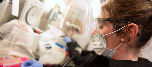 Kylene Karnuth, a clinical lab scientist, works with coronavirus samples as researchers begin a trial to see whether malaria treatment hydroxychloroquine can prevent or reduce the severity of the coronavirus disease (COVID-19), at the University of Minnesota in Minneapolis, Minnesota, U.S. March 19, 2020. Kylene Karnuth, a clinical lab scientist, works with coronavirus samples as researchers begin a trial to see whether malaria treatment hydroxychloroquine can prevent or reduce the severity of the coronavirus disease (COVID-19), at the University of Minnesota in Minneapolis, Minnesota, U.S. March 19, 2020. - Sputnik International
