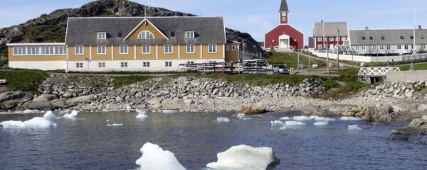 In this image taken on June 13, 2019 small pieces of ice float in the water off the shore in Nuuk, Greenland - Sputnik International