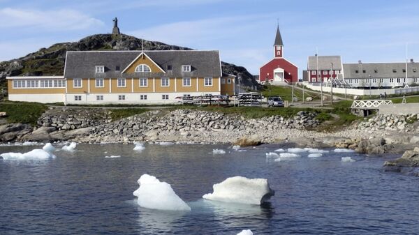 In this image taken on June 13, 2019 small pieces of ice float in the water off the shore in Nuuk, Greenland - Sputnik International