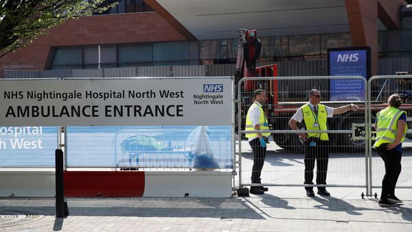 Security are seen outside the NHS Nightingale North West Hospital at the Manchester Central Convention Complex in Manchester as the spread of the coronavirus disease (COVID-19) continues, Manchester, Britain, April 11, 2020 - Sputnik International