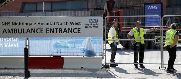 Security are seen outside the NHS Nightingale North West Hospital at the Manchester Central Convention Complex in Manchester as the spread of the coronavirus disease (COVID-19) continues, Manchester, Britain, April 11, 2020 - Sputnik International