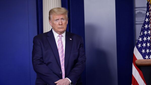 U.S. President Donald Trump listens during the coronavirus response daily briefing at the White House in Washington, U.S., April 10, 2020.  - Sputnik International