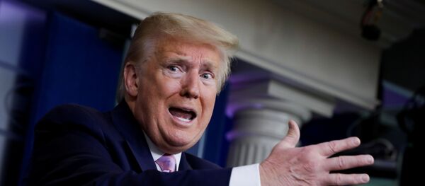 U.S. President Donald Trump answers a question from CNN's chief White House correspondent Jim Acosta about hospitals and frontline health care workers reporting shortages of masks and coronavirus tests during the coronavirus response daily briefing at the White House in Washington, U.S., April 10, 2020. - Sputnik International