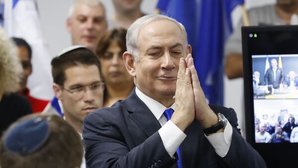 Israel's Prime Minister and leader of the Likud Party Benjamin Netanyahu gestures as he delivers a statement in the Israeli central city of Petah Tikva on March 7, 2020.  - Sputnik International