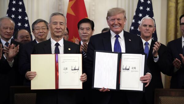 In this Wednesday, Jan. 15, 2020, file photo, U.S. President Donald Trump, right, signs a trade agreement with Chinese Vice Premier Liu He, in the East Room of the White House, in Washington - Sputnik International