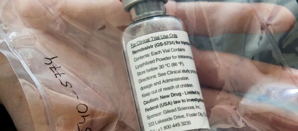 An ampule of Ebola drug Remdesivir is pictured during a news conference at the University Hospital Eppendorf (UKE) in Hamburg, Germany, April 8, 2020, as the spread of coronavirus disease (COVID-19) continues. An ampule of Ebola drug Remdesivir is pictured during a news conference at the University Hospital Eppendorf (UKE) in Hamburg, Germany, April 8, 2020, as the spread of coronavirus disease (COVID-19) continues. - Sputnik International