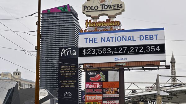 A billboard displaying the U.S. national debt is displayed along the Las Vegas Strip, Wednesday, March 18, 2020 - Sputnik International
