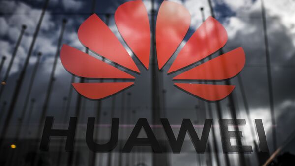The logo of Chinese telecom giant Huawei is pictured during the Web Summit in Lisbon on November 6, 2019 - Sputnik International