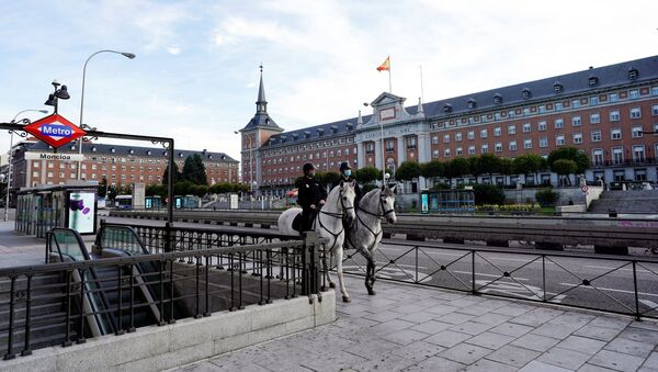 Police officers patrol on horseback during the coronavirus disease (COVID-19) outbreak in Madrid, Spain April 13, 2020 - Sputnik International