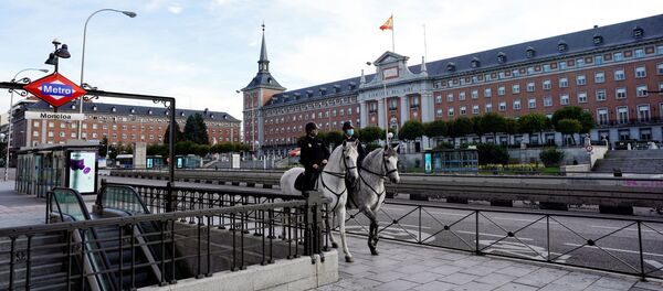 Police officers patrol on horseback during the coronavirus disease (COVID-19) outbreak in Madrid, Spain April 13, 2020 - Sputnik International