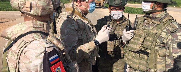 Soldiers of the Russian military police and the Turkish military during a joint patrol of the M-4 highway in Idlib province in Syria Soldiers of the Russian military police and the Turkish military during a joint patrol of the M-4 highway in Idlib province in Syria - Sputnik International