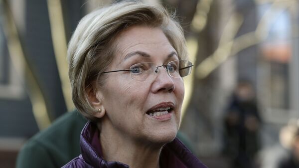 FILE - In this Thursday, March 5, 2020, file photo, Sen. Elizabeth Warren, D-Mass., speaks to the media outside her home in Cambridge, Mass., after she dropped out of the Democratic presidential race - Sputnik International