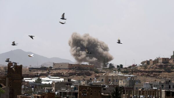 Dust rises from the site of a Saudi-led air strike in Sanaa - Sputnik International