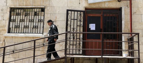 A man walks down the stairs inside a medical center that deals with coronavirus disease (COVID-19) testing in Idlib, Syria 13 April 2020.  - Sputnik International