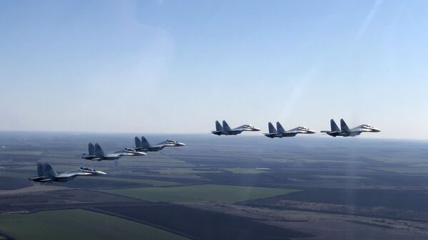 In this handout photo released by the Russian Defence Ministry, Su-30SM jet fighters of the 4th Air and Air Defence Forces Army of the Russian Southern Military District fly in formation during a rehearsal for the Victory Day parade in Rostov-on-Don, which marks the 75th anniversary of the victory over Nazi Germany in World War Two, in Rostov region, Russia - Sputnik International