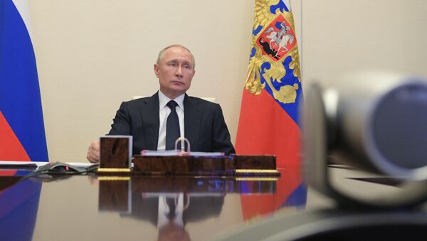 Russian President Vladimir Putin attends a meeting with members of the government via teleconference call at Novo-Ogaryovo state residence, outside Moscow, Russia - Sputnik International