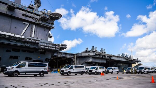 Seabees assigned to Naval Mobile Construction Battalion (NMCB) 1 and NMCB 5 coordinate transportation of Sailors assigned to the aircraft carrier USS Theodore Roosevelt (CVN 71) who have tested negative for COVID-19 and are asymptomatic from Naval Base Guam to government of Guam and military- approved commercial lodging. - Sputnik International