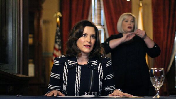 In this photo provided by the Michigan Office of the Governor, Michigan Gov. Gretchen Whitmer addresses the state during a speech in Lansing, Mich., Thursday, April 2, 2020 - Sputnik International