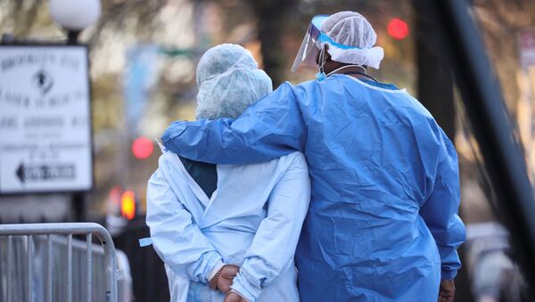Medical workers walk during a short break at Maimonides Medical Center during the outbreak of the coronavirus disease (COVID19) in the Brooklyn borough of New York, U.S., April 16, 2020. Picture taken April 16, 2020 - Sputnik International