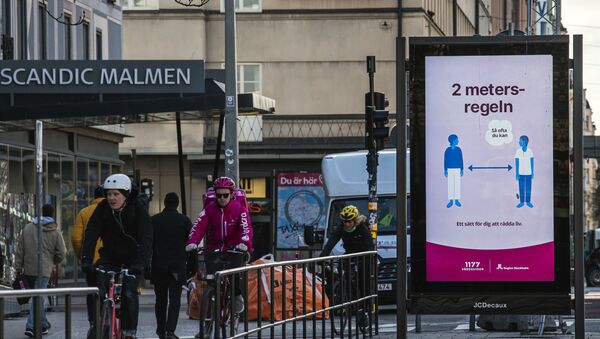 An advertisement of the healthcare services of Sweden instructs people to follow the 2 meters rule to reduce the risk of getting sick, in Stockholm on April 14, 2020. - Sputnik International