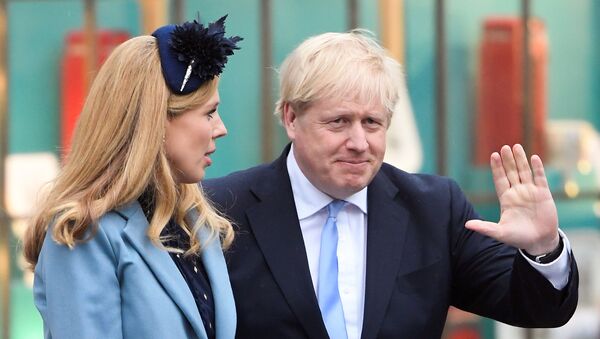 Britain's Prime Minister Boris Johnson and his partner Carrie Symonds leave after the annual Commonwealth Service at Westminster Abbey in London, Britain March 9, 2020 - Sputnik International